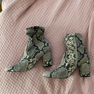 Snake skin sock booties with heel.